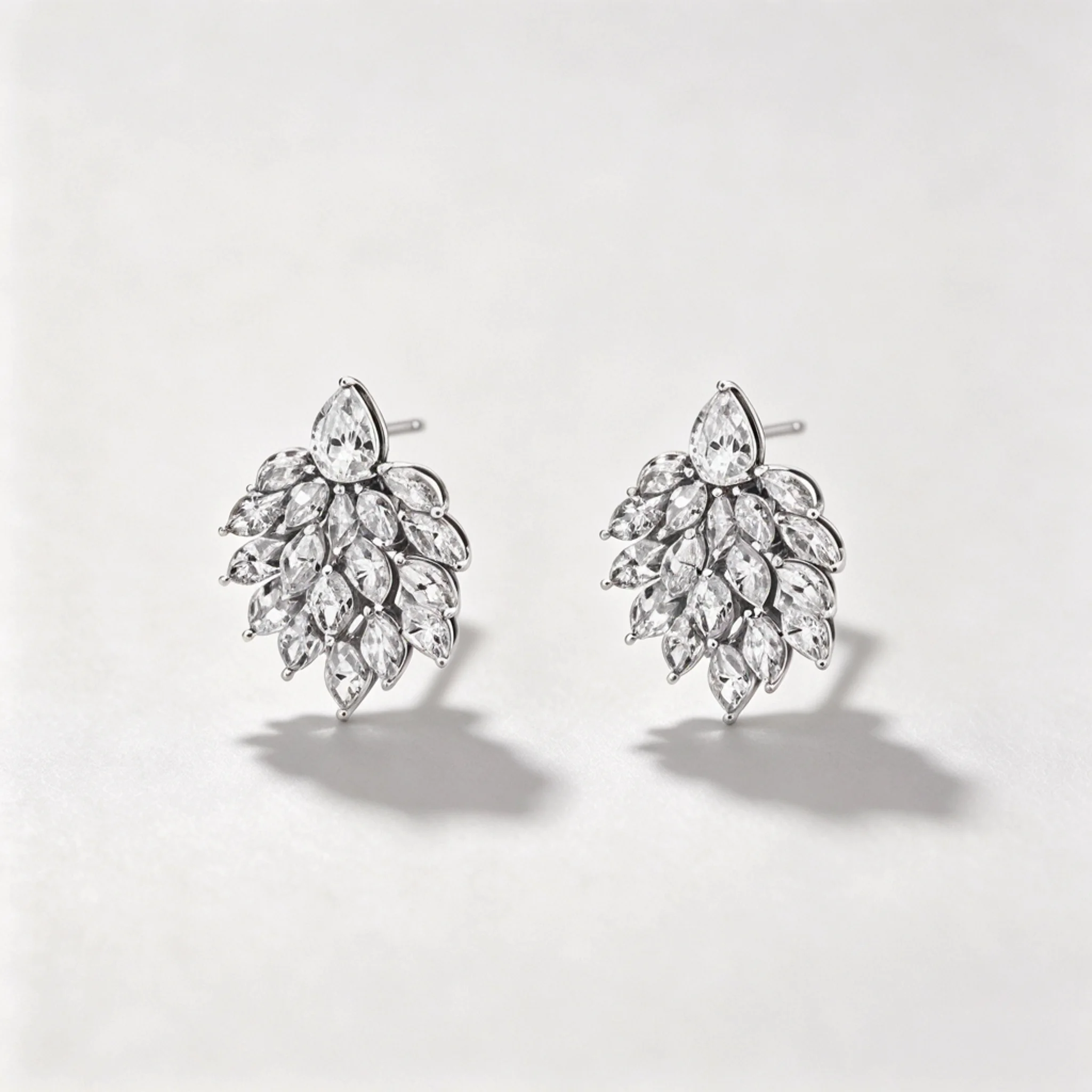 Diamond cluster earrings product photo showing grouped stones and overall setting shape