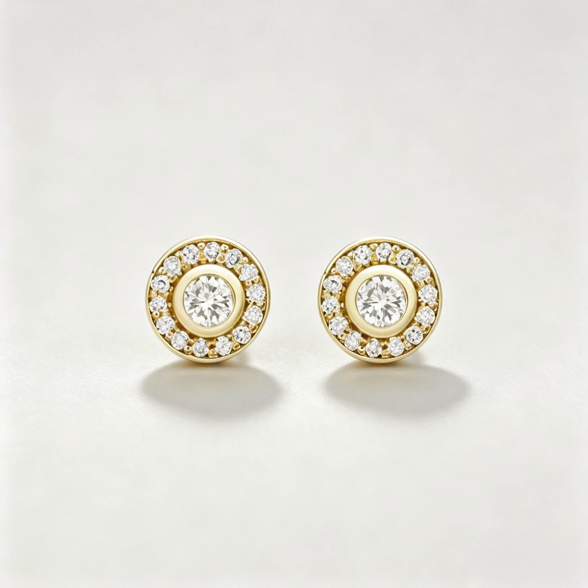 Diamond halo earrings product photo showing center stone and surrounding halo detail
