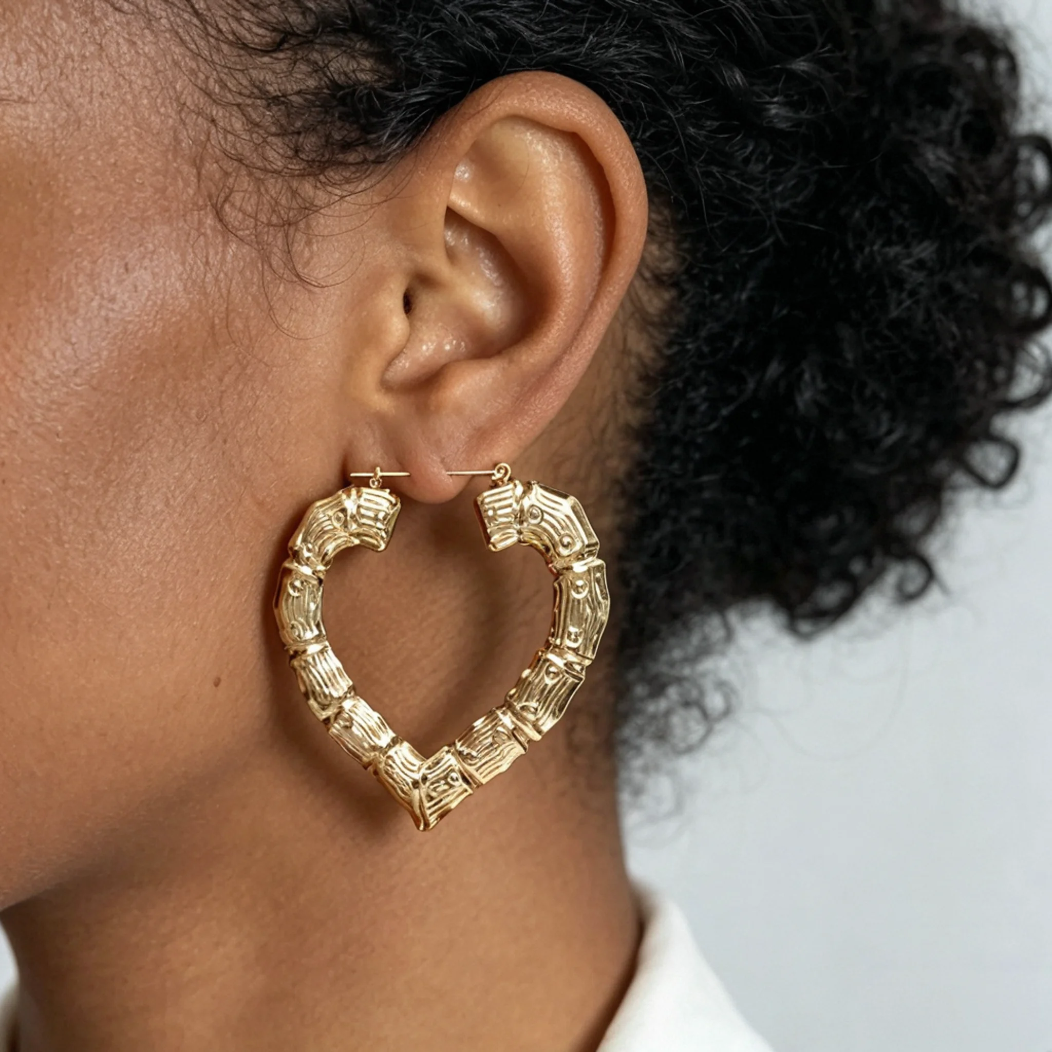 door-knocker bamboo earrings shown beside the ear