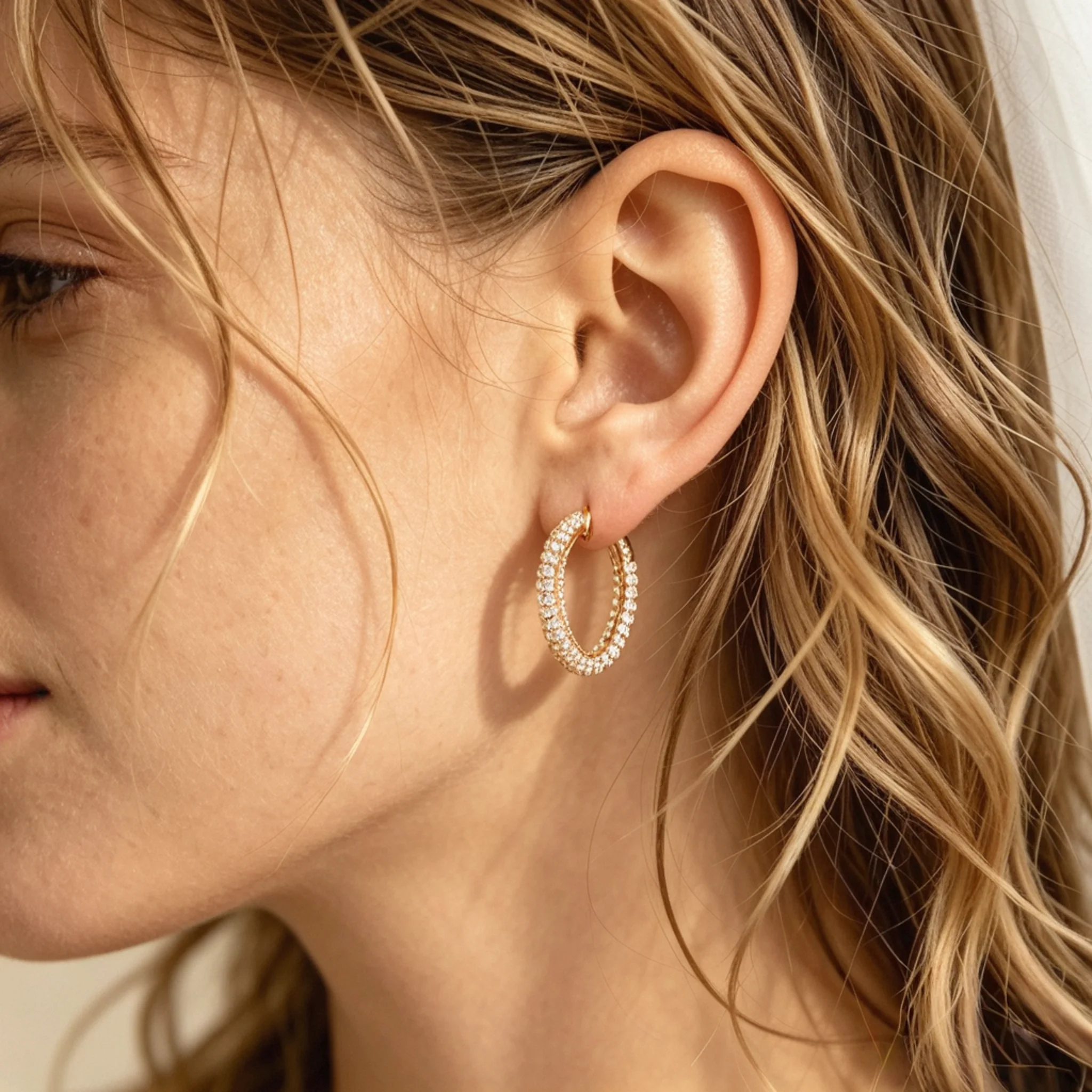 Hoop bridal earrings shown on a model with modern wedding styling