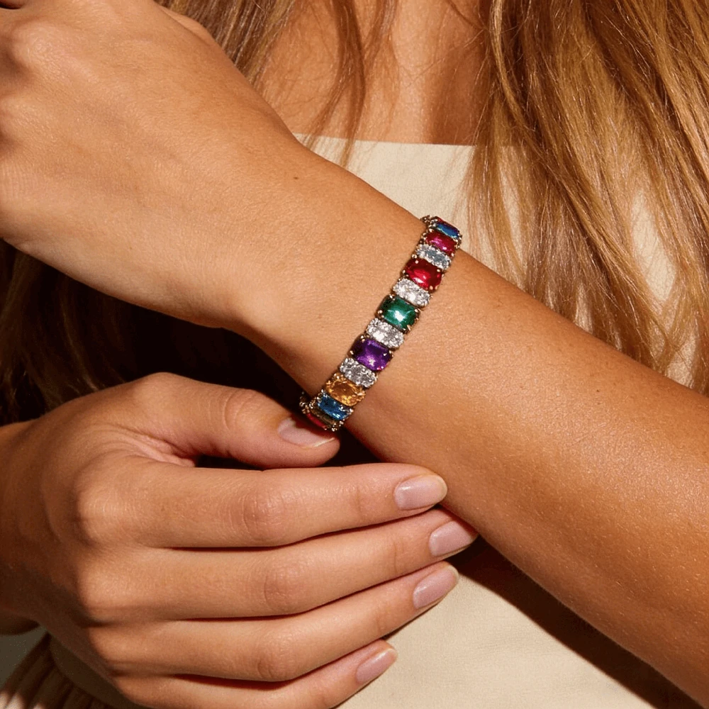 AI-generated colorful tennis bracelet on a wrist in a product listing style photo.