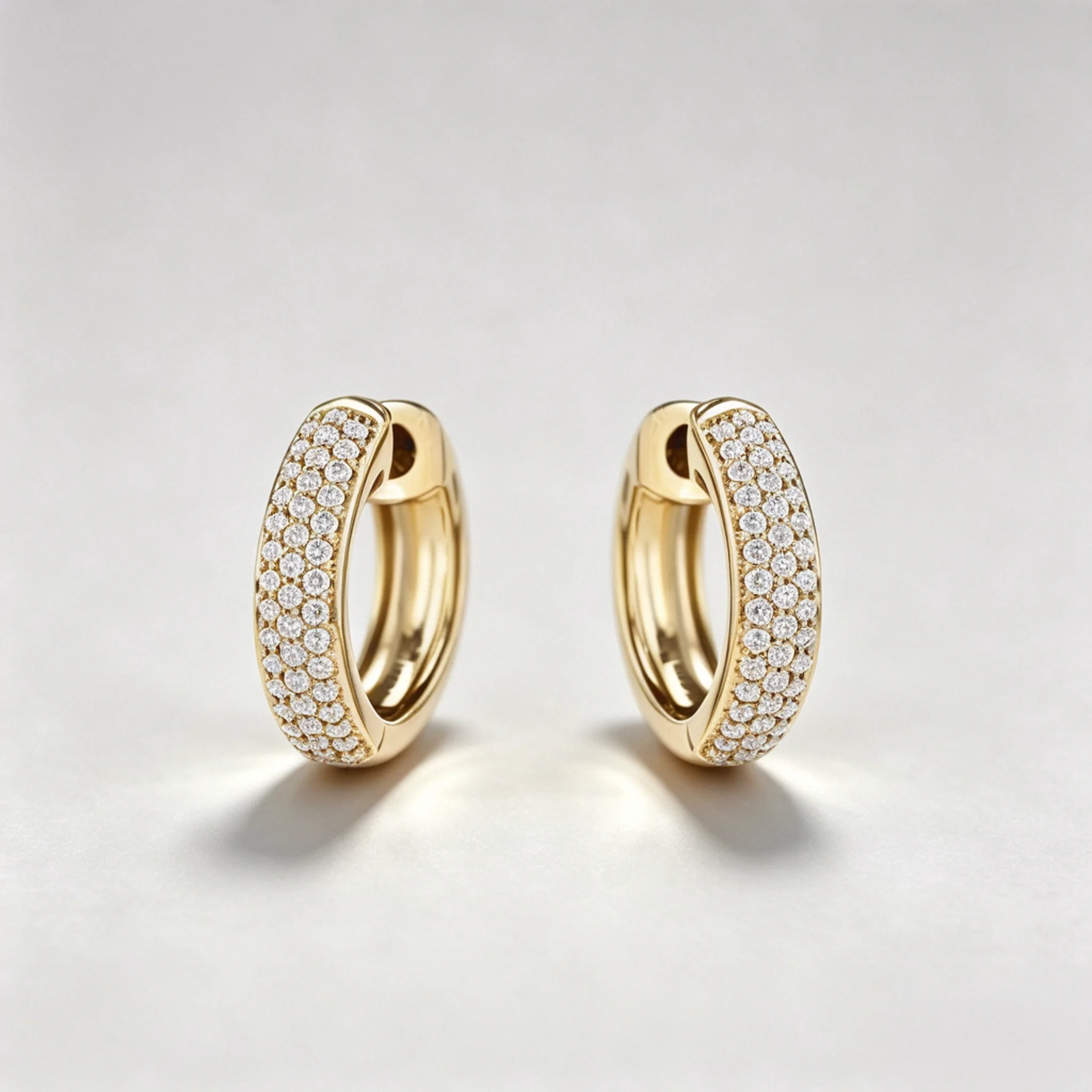 Pavé diamond earrings product photo showing small stone rows and surface detail