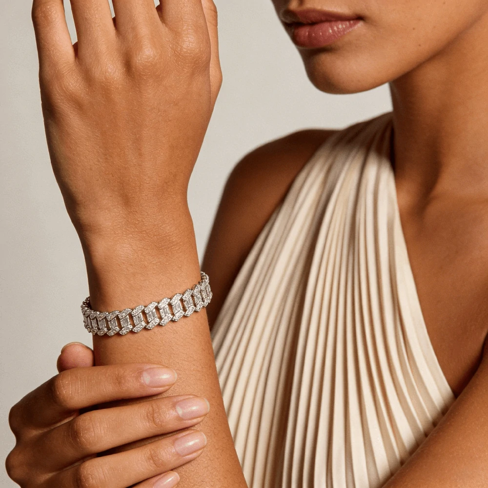 AI-generated tennis bracelet on a model’s wrist showing the regular length.