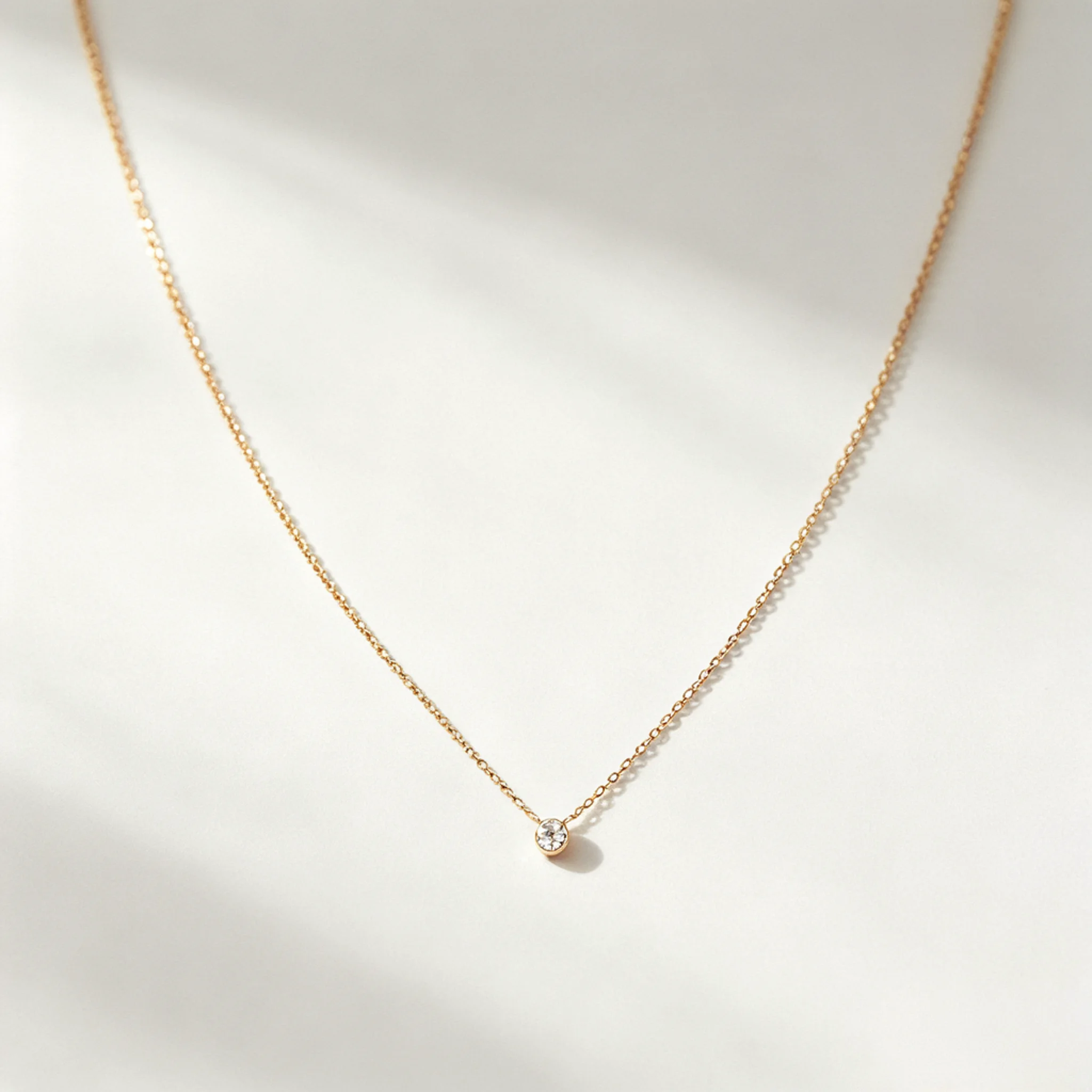solitaire diamond necklace product photo with single round stone and fine chain