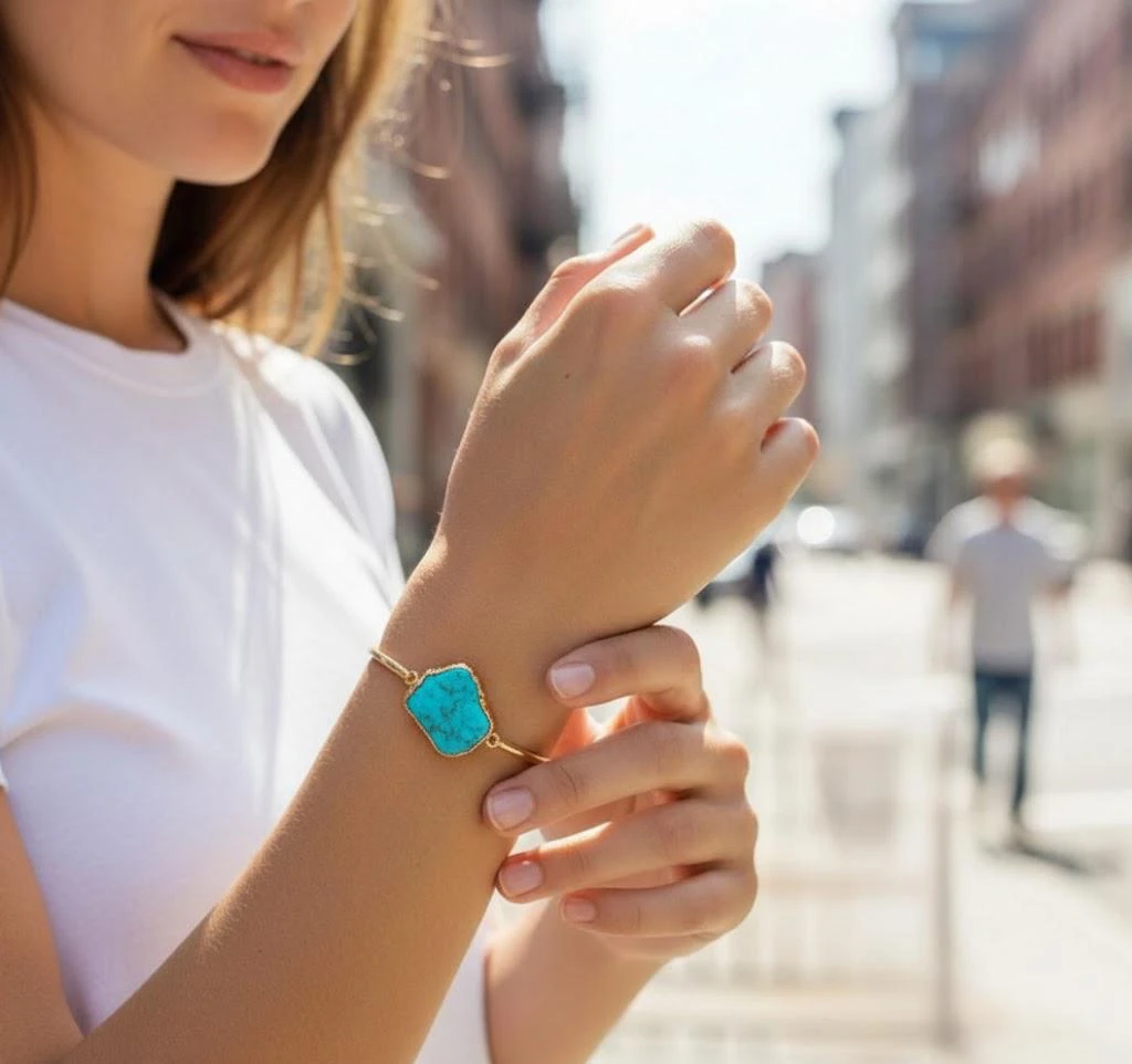 Stone bracelet on an AI model’s wrist, showing natural stone texture and color.