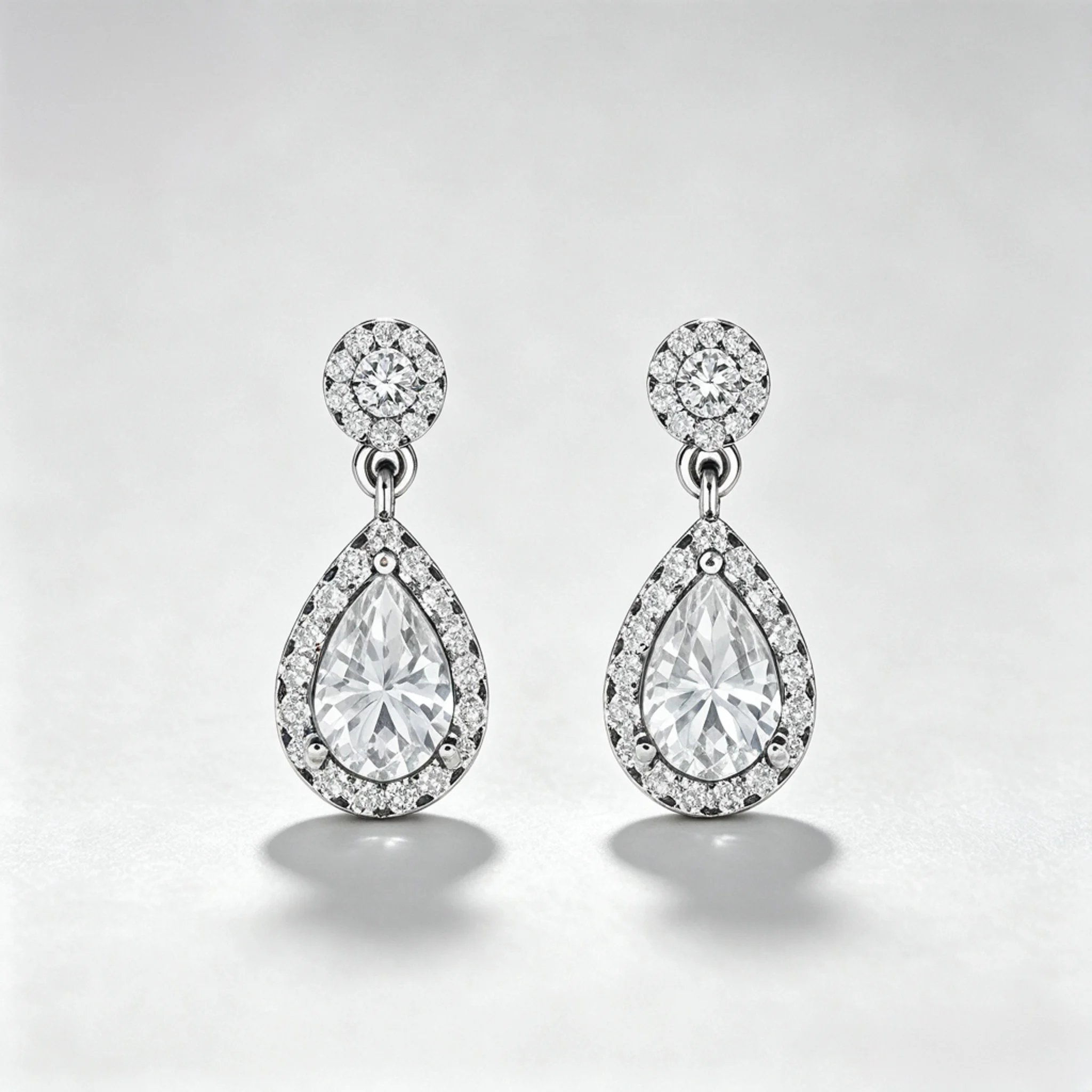 Teardrop diamond earrings product photo showing drop shape and stone outline